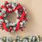 Glitzhome® 24" Flocked Berry, Pinecone & Ribbon Wreath